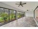 Spacious Florida room with tile flooring and view of backyard at 7157 Fairway Bend Cir, Sarasota, FL 34243