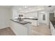 Modern kitchen with white cabinets and granite countertops at 7157 Fairway Bend Cir, Sarasota, FL 34243