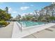 Community swimming pool with ample deck space at 7157 Fairway Bend Cir, Sarasota, FL 34243