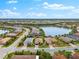 Aerial view of a house, neighborhood, and lake at 7409 Chester Trl, Bradenton, FL 34202