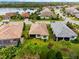 Aerial view showcasing houses with lake access at 7409 Chester Trl, Bradenton, FL 34202