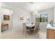 Bright dining room, hardwood floors, and large windows at 7409 Chester Trl, Bradenton, FL 34202