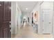 Bright and airy foyer with tile floors, artwork, and a glass-top console table at 7409 Chester Trl, Bradenton, FL 34202