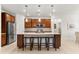 Modern kitchen with island and stainless steel appliances at 7409 Chester Trl, Bradenton, FL 34202