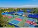 Aerial view of community pickleball courts with players at 7409 Chester Trl, Bradenton, FL 34202