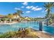 Resort-style pool with fountain and lounge chairs at 7409 Chester Trl, Bradenton, FL 34202