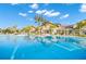 Refreshing pool with clear water and a clubhouse in the background at 7409 Chester Trl, Bradenton, FL 34202