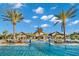 Large community pool with palm trees and clubhouse at 7409 Chester Trl, Bradenton, FL 34202