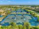 Aerial view of community tennis courts with players at 7409 Chester Trl, Bradenton, FL 34202