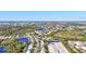 Gorgeous aerial community view with homes surrounded by waterways, lush landscape, and beautiful scenery at 7453 Featherstone Blvd, Sarasota, FL 34238