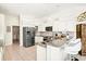 Well-equipped kitchen featuring stainless steel appliances, granite countertops, and ample cabinet space at 7453 Featherstone Blvd, Sarasota, FL 34238