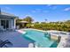 Inviting pool and spa with gazebo in a private backyard, surrounded by vibrant landscaping at 7453 Featherstone Blvd, Sarasota, FL 34238