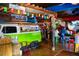 Island-themed bar interior with colorful decor, a VW bus, and a lively atmosphere for a relaxed dining experience at 7453 Featherstone Blvd, Sarasota, FL 34238