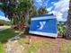 YMCA sign near lush green foliage on a sunny day at 7453 Featherstone Blvd, Sarasota, FL 34238