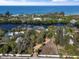 Aerial view of waterfront property showcasing expansive lot and canal access at 7536 Midnight Pass Rd, Sarasota, FL 34242