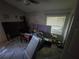 Bedroom with window blinds and ongoing renovations at 7561 120Th Ave, Largo, FL 33773