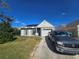 Single-story house with solar panels and a driveway at 7561 120Th Ave, Largo, FL 33773