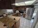 Kitchen with stainless steel appliances and wood cabinets at 7561 120Th Ave, Largo, FL 33773