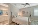 Bright bedroom with a queen-size bed and ensuite bathroom at 7590 Summerland Cv, Bradenton, FL 34202