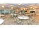 Elegant clubhouse dining room with multiple tables at 7590 Summerland Cv, Bradenton, FL 34202