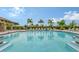 Resort-style pool with plenty of lounge chairs at 7590 Summerland Cv, Bradenton, FL 34202