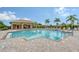 Community pool and relaxing lounge area at 7590 Summerland Cv, Bradenton, FL 34202