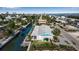 Aerial view of canal-front home with dock at 765 Saint Judes N Dr, Longboat Key, FL 34228