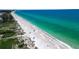 Aerial view of beach with turquoise water at 765 Saint Judes N Dr, Longboat Key, FL 34228