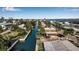 Aerial view of waterfront homes and canal at 765 Saint Judes N Dr, Longboat Key, FL 34228