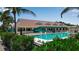 Relaxing community pool with lounge chairs at 765 Saint Judes N Dr, Longboat Key, FL 34228