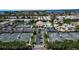 Resort-style community pool with tennis courts at 765 Saint Judes N Dr, Longboat Key, FL 34228