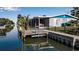 Private dock with steps leading to the water at 765 Saint Judes N Dr, Longboat Key, FL 34228