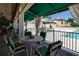 Relaxing patio with pool and bar views at 765 Saint Judes N Dr, Longboat Key, FL 34228