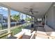 Spacious covered patio with canal views and comfortable seating at 765 Saint Judes N Dr, Longboat Key, FL 34228