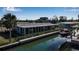 Stunning canal-front property with private boat dock and lush landscaping at 765 Saint Judes N Dr, Longboat Key, FL 34228