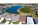 Aerial view of home near lake in a new neighborhood at 8219 Abalone Loop, Parrish, FL 34219