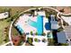 Aerial view of resort-style pool with lounge chairs and playground at 8219 Abalone Loop, Parrish, FL 34219