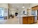 Modern kitchen with island, stainless steel appliances, and light wood cabinets at 8219 Abalone Loop, Parrish, FL 34219