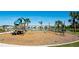 playground with wooden playset near a pond at 8219 Abalone Loop, Parrish, FL 34219