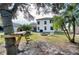 Spacious backyard with fire pit, patio, and mature trees at 8260 47Th Street E Cir, Palmetto, FL 34221