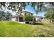 Large backyard with patio, lawn, and play area at 8260 47Th Street E Cir, Palmetto, FL 34221