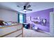 Bedroom with purple wall, built-in bed and desk area at 8260 47Th Street E Cir, Palmetto, FL 34221