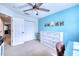 Bedroom with light blue walls, desk and built in dresser at 8260 47Th Street E Cir, Palmetto, FL 34221