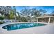 Community pool with lounge chairs and covered seating at 8260 47Th Street E Cir, Palmetto, FL 34221