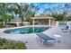 Community pool with lounge chairs and covered seating at 8260 47Th Street E Cir, Palmetto, FL 34221