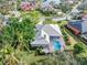 High-angle view of a home showcasing a pool and screened enclosure at 8624 Woodbriar Dr, Sarasota, FL 34238