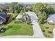 Bird's-eye view of a single-story house, lush landscaping, and a driveway at 8624 Woodbriar Dr, Sarasota, FL 34238