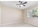 Spacious bedroom with large window and ceiling fan at 8624 Woodbriar Dr, Sarasota, FL 34238