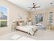 Bright bedroom with direct access to the pool and a ceiling fan at 8624 Woodbriar Dr, Sarasota, FL 34238