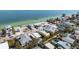 An aerial view of a home with a pool with the bay in the background at 866 N Shore Dr, Anna Maria, FL 34216